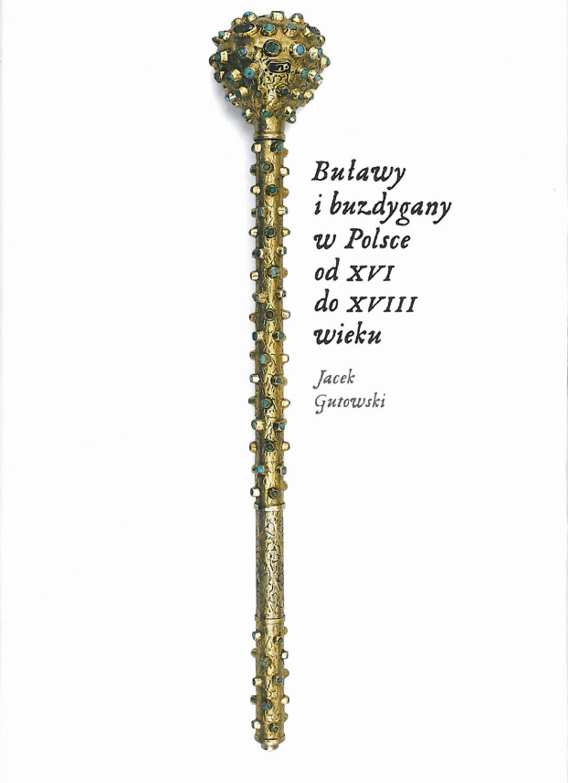 Współczesna okładka do publikacji "Buławy i buzdygany w Polsce od XVI do XVIII w." Na białej okładce złota buława z drogocennymi kamieniami.